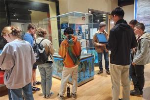 Kaitlyn Horisk with students in Earth and Mineral Sciences Museum